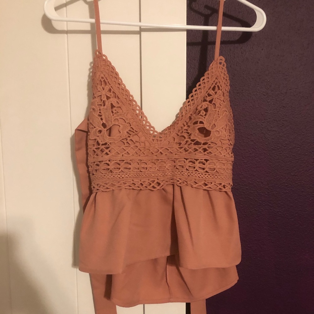 Crop top tank with crochet and tie back.